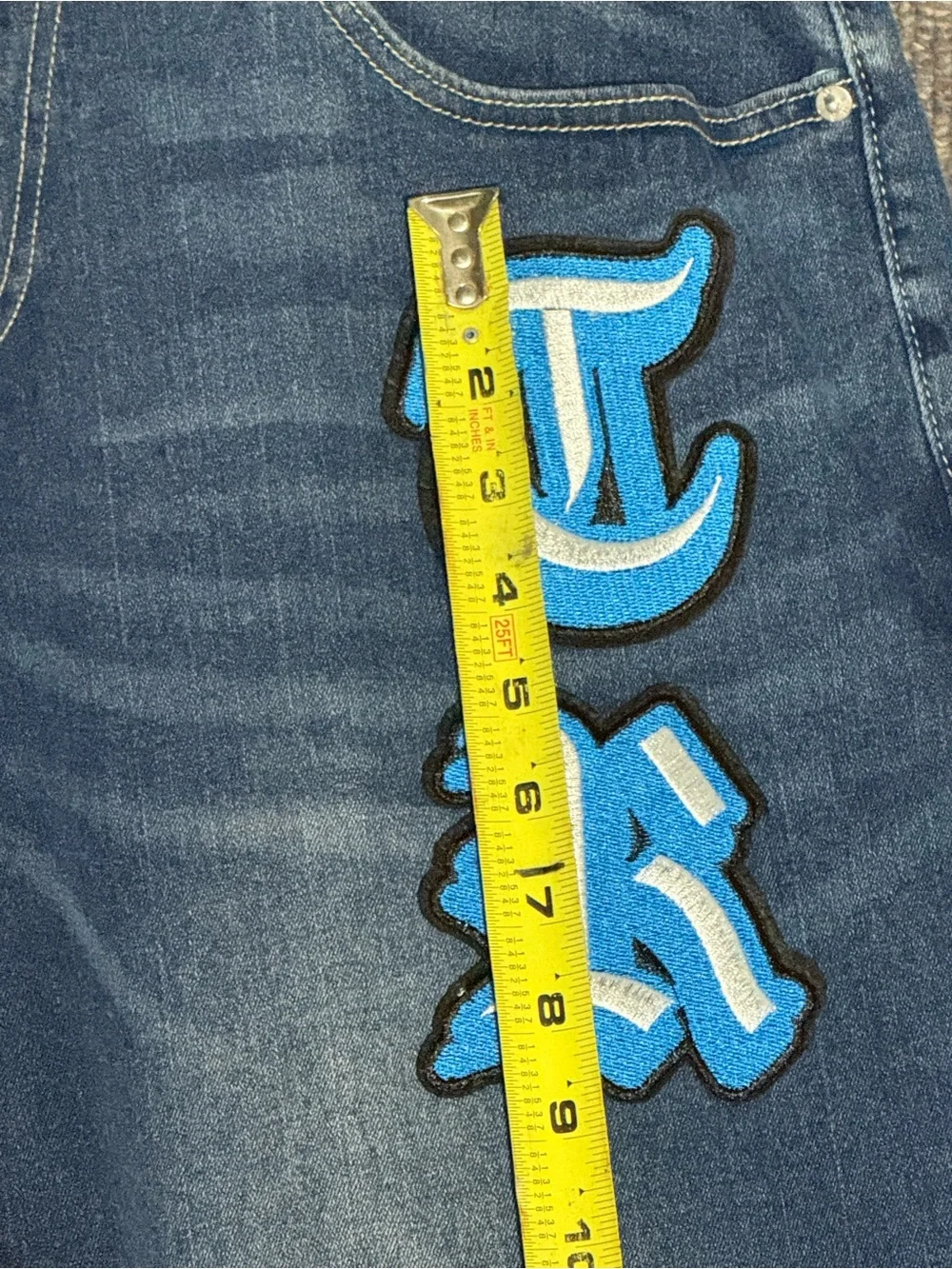 True Religion Men's Blue Jeans with Turquoise Script Patch